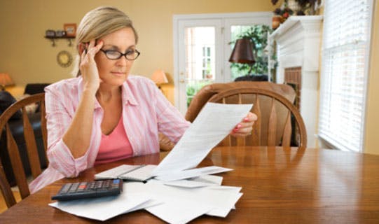 Woman paying bills